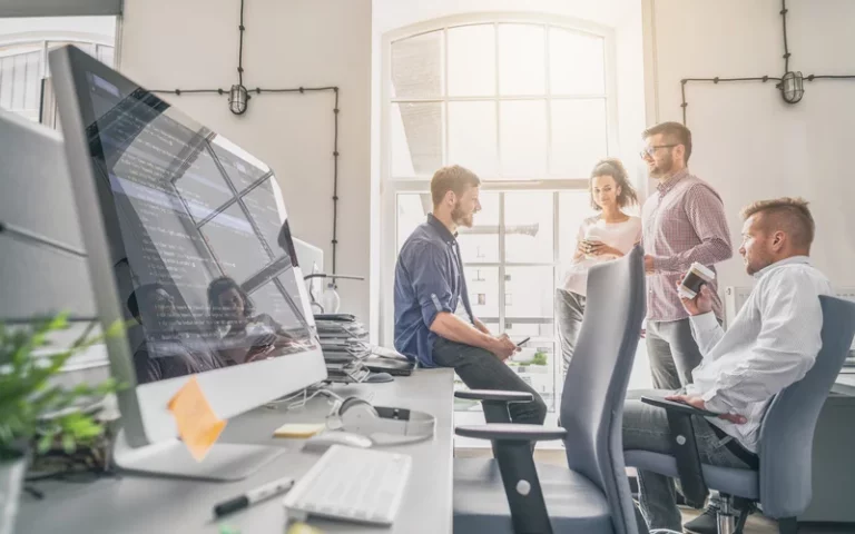 Software development team collaborating in an office