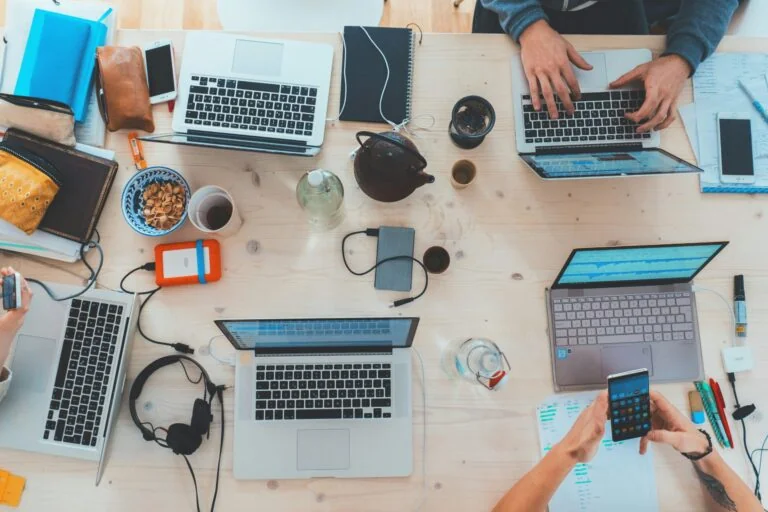 Diverse software team working together around a table